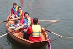Kids rowing in boat