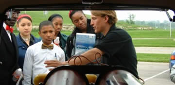 Tai Robinson showing his converted Hummer to schoolchildren in Kansas